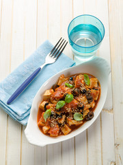 tofu with tomato black olives and sesame seeds