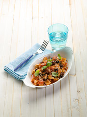 tofu with tomato black olives and sesame seeds