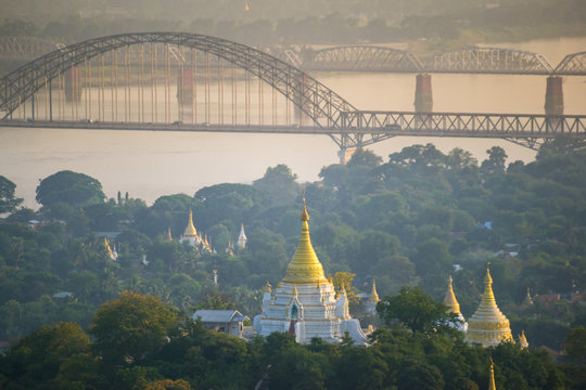 the bridge across Irrawadee river and the old pagodas in Sagaing Area. Mandalay. Myanmar
