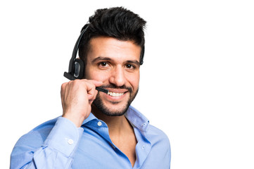 Young man wearing headset on white background