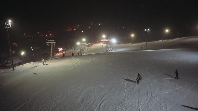 Winter outdoor activities of tourists. Aerial shot ski resort