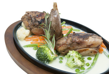 roasted rabbit meat and potatoes with vegetables