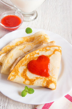 Pancakes with strawberry jam heart
