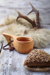 Rue bun with seeds and finnish cup kuksa