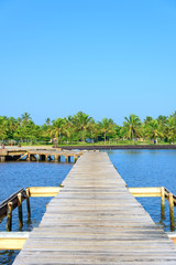 wooden bridge juts out into  of the sea