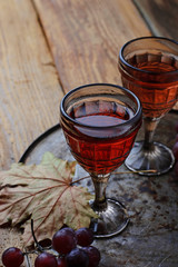Glass of red wine and grape