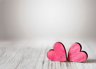 Valentines day background with two red hearts on wooden background - obrazy, fototapety, plakaty