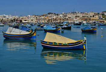 Fototapeta na wymiar Traditional luzzu boats in Malta