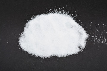 Obraz na płótnie Canvas Pile of Can Sugar isolated on black background