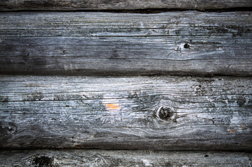 Dark old timbered wooden loghouse wall