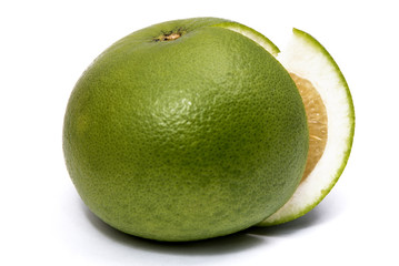 Sweet green grapefruit and cut piece isolated on white
