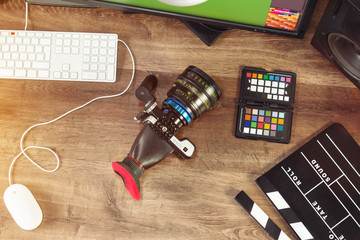 Desktop top shot of a modern Cinema Camera on stylish wooden workplace