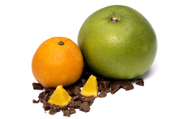 Green sweet grapefruit and orange with a cut piece on a broken chocolate isolated on white