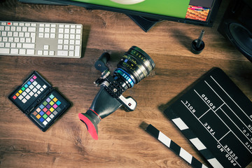 Desktop top shot of a modern Cinema Camera on stylish wooden workplace