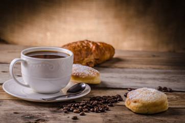 Fresh coffee with croissant