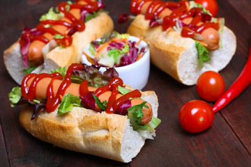 home made Hot dog - sandwich with lettuce on wooden background