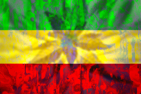 Cannabis bud on grunge rastafarian flag.
