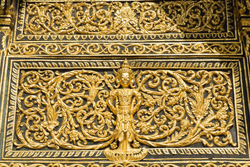 Close up of pediment of temple above the entrance of buddhist sanctuary