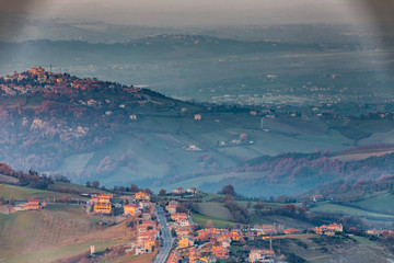sunset on hilly countryside in winter
