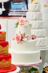 White wedding cake decorated with flowers