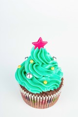 Seasonal festive Christmas mini dessert cupcakes in traditional decorative symbols elements.