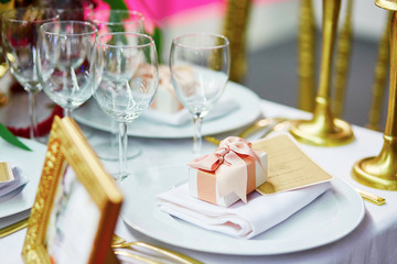 Table set for an event with compliment for guests