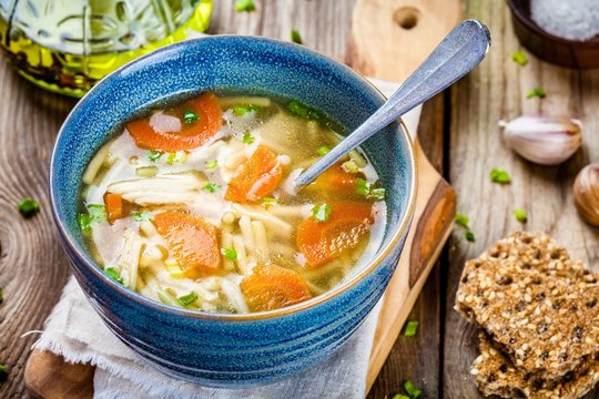 chicken noodle soup with carrots and green onions