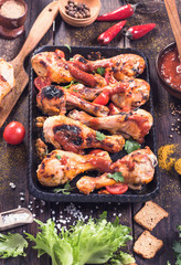 Drumsticks on serving pan