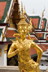 Temple or wat in Bangkok Thailand. Kinnaree sculpture is mythological creature, half of bird and girl at Wat Phra Kaew also called Grand Palace.
