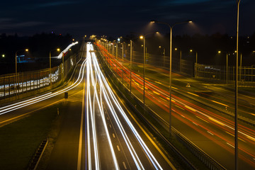 Fototapeta na wymiar Car lights on a highway