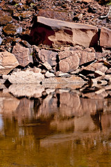 Fototapeta premium reflections in rocky pond
