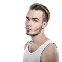 Fototapeta premium Portrait of young man, isolated on white background, image toned