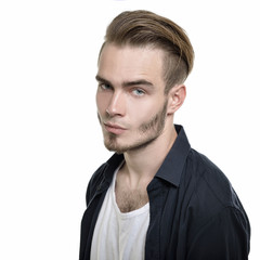 Obraz premium Portrait of young man over white background, image toned.