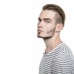 Portrait of young man, isolated on white background, image toned