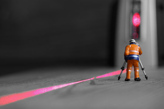 Miniature construction worker laser level / Miniature scale model construction worker with a laser level