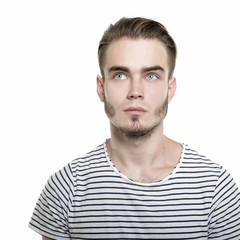 Obraz premium Portrait of young man over white background, image toned.