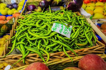 Green beans and fruits on a market stall