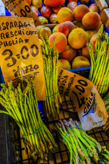 Asparagus and peaches on a market stall