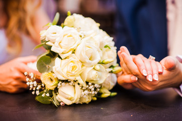 The bride and groom holding hands