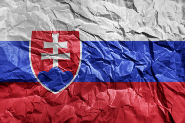 Slovakia flag painted on crumpled paper background