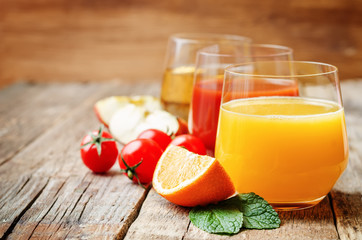 set of juices: orange, tomato and apple