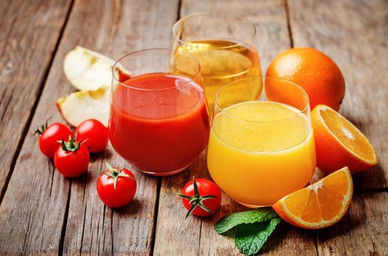 set of juices: orange, tomato and apple