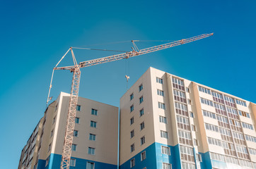 Fototapeta na wymiar Residential development and column crane