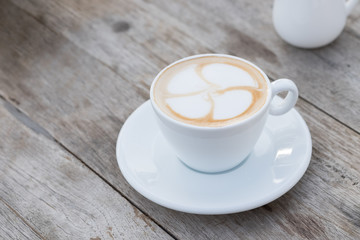 Cup of coffee on wood table