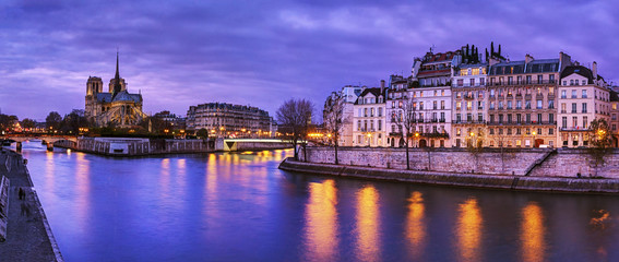 Fototapeta na wymiar Paris, France: Notre Dame at dusk with Seine river on foreground