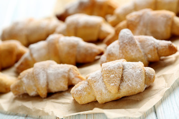 Fresh homemade croissants on a blue wooden table