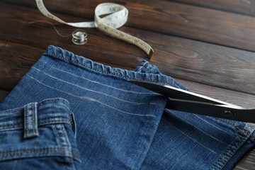 Jeans with dressmaking sewing utensils needlework