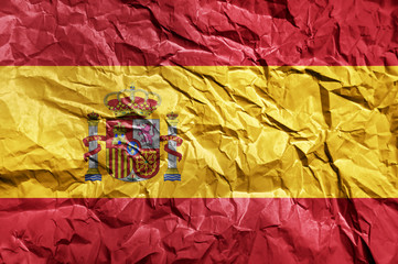 Spain flag painted on crumpled paper background