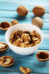 Walnuts on a blue wooden table