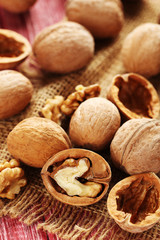 Walnuts on a red wooden table